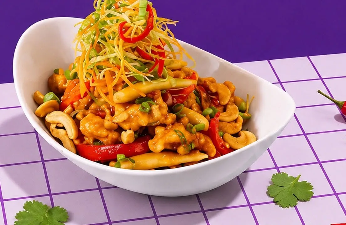 Chicken cashew nut salad piled with crispy vegetable strands.