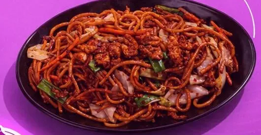 A plate of stir fried dragon noodles.