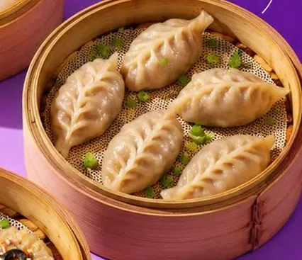Chicken lemongrass dumplings in a bamboo steamer.
