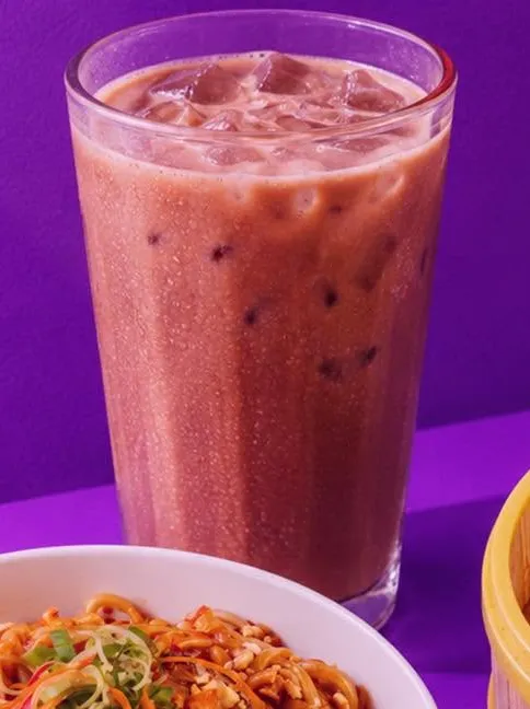 A tall glass of Langkawi Iced Milo over ice.